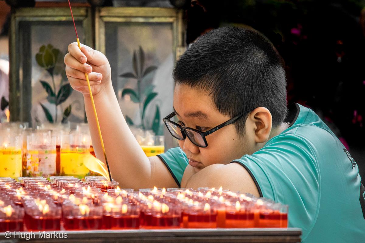 Concentration in the Temple - Saigon by Hugh Markus